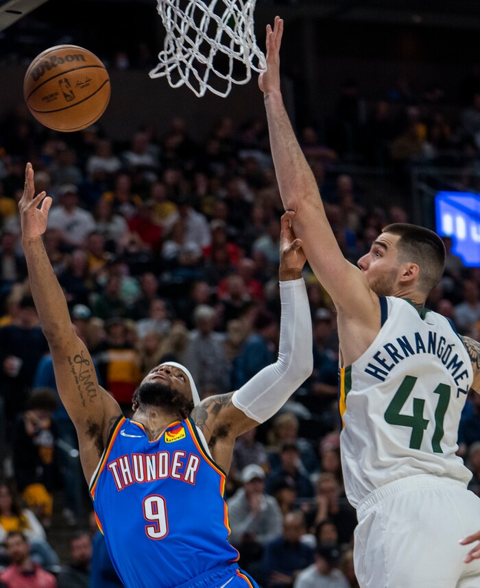 (Rick Egan | The Salt Lake Tribune) Oklahoma City Thunder guard Zavier Simpson shoots as Utah Jazz forward Juancho Hernangomez (41) defends, in NBA action between the Utah Jazz and the Oklahoma City Thunder at Vivint Arena, on Wednesday, April 6, 2022.
