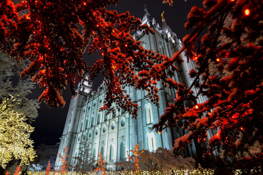 (Francisco Kjolseth  |  The Salt Lake Tribune)  Visitors take in the sights as Temple Square in Salt Lake City comes to life Friday, November 29, 2019, as hundreds of thousands of colorful LED bulbs light up, a yearly tradition that started in 1965. The lights will run through the end of the year.