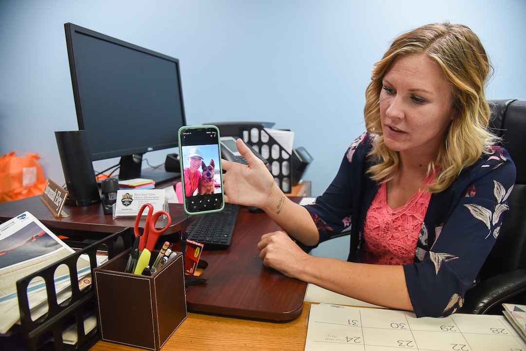 (Francisco Kjolseth | The Salt Lake Tribune)  Savannah Eley shows off a picture of her dog "Trapper," a red heeler donated to her by one of the officers who has helped her regain her sobriety. Now two and half years clean, Eley works as a peer support specialist at the Southeast Utah Health Department in Price.