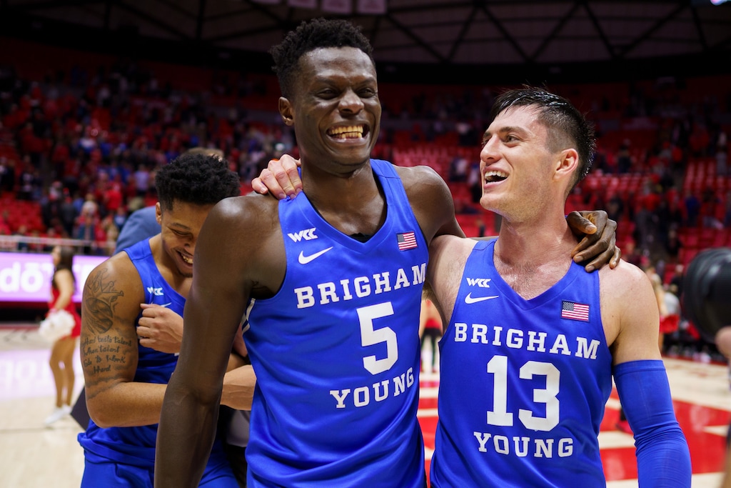 (Trent Nelson  |  The Salt Lake Tribune) Brigham Young Cougars forward Gideon George (5) and Brigham Young Cougars guard Alex Barcello (13) walk off the court after a win last month. On Saturday, Barcello led the Cougars to victory over Weber State.