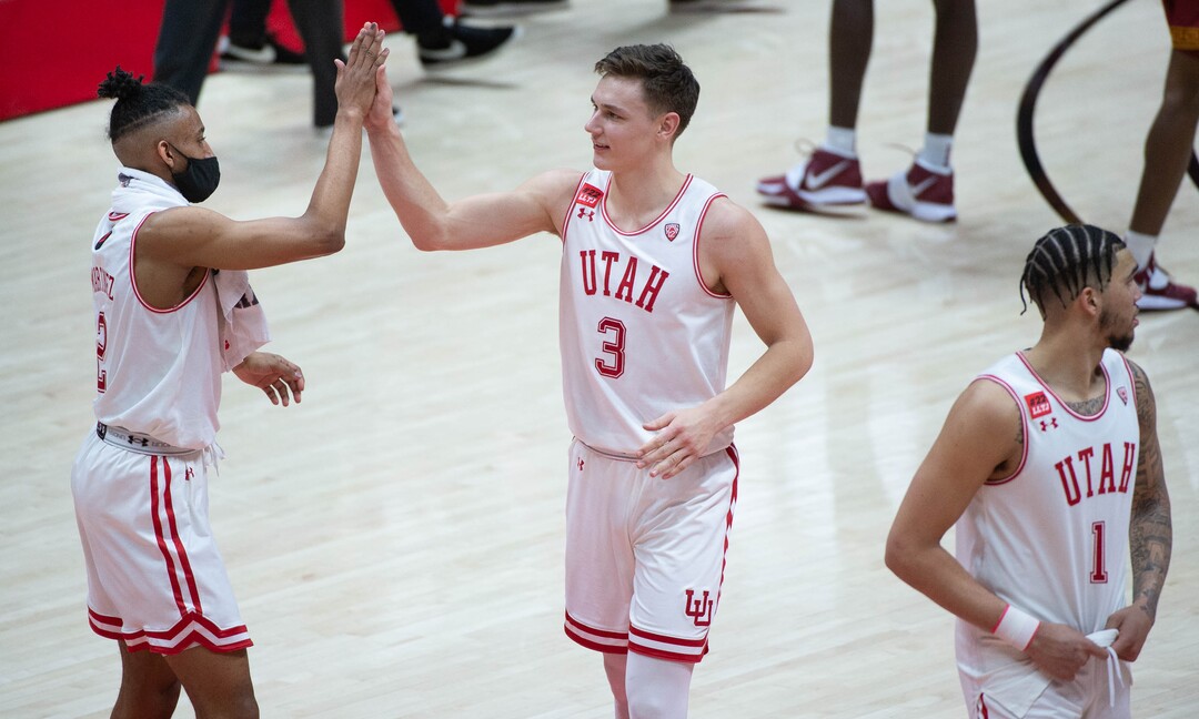 (Francisco Kjolseth  | The Salt Lake Tribune) Utah Utes guard Ian Martinez (2) and Utah Utes guard Pelle Larsson (3) celebrate a win for the Utes against USC in PAC-12 basketball action at the Jon M. Huntsman Center, on Saturday, Feb. 27, 2021.