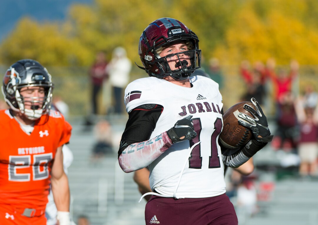 (Rick Egan  |  The Salt Lake Tribune)   Jordan running back Jake Shaver (11) runs for a touchdown, in prep 5A playoff action between Jordan High and Skyridge High, in Lehi, Friday, Nov. 2, 2018.
