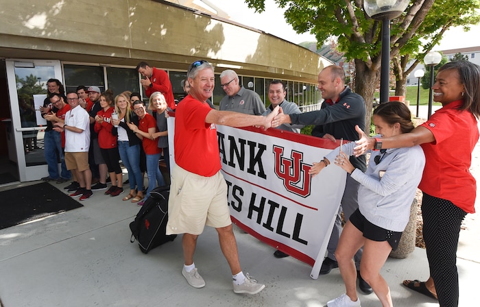 (Francisco Kjolseth  |  The Salt Lake Tribune)  University of Utah athletic director Chris Hill says goodbye to friends and staff at the Huntsman Center on Friday, June 1, 2018, before climbing aboard a red Ute-branded Holiday Motor coach bus to the sounds of cheers and applause after 31 years on the job.
