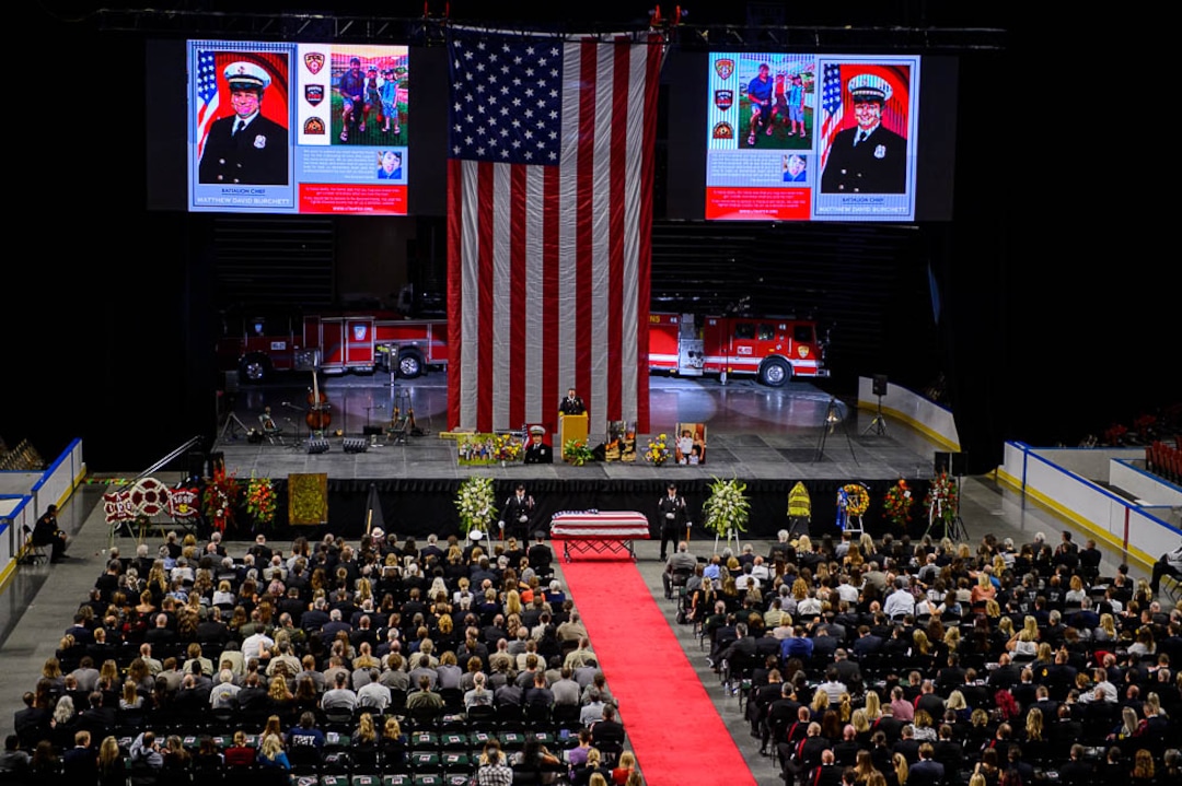 (Trent Nelson | The Salt Lake Tribune)  Funeral services for Battalion Chief Matthew Burchett at the Maverik Center in West Valley City, Monday Aug. 20, 2018.