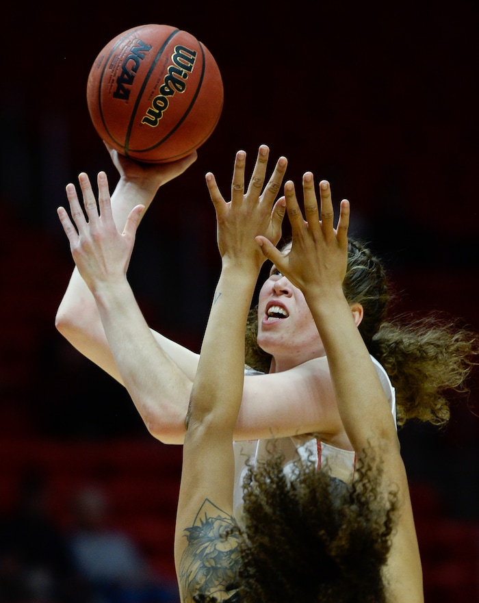 (Francisco Kjolseth  |  The Salt Lake Tribune)  Utah Utes center Megan Huff (5) pushes past the defense as Utah hosts UNLV in women's NCAA basketball at the Huntsman Center, Thursday, March 15, 2018.