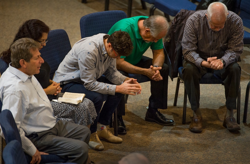 (Leah Hogsten  |  The Salt Lake Tribune) Evangelical pastors representing congregations with Standing Together Ministries pray for victims of violence from Sutherland Springs, New York and Las Vegas prior to their meeting on how to train for an active shooter situation within their houses of worship.  "No place is sacred now," said Rev. Greg Johnson. "If a rural church in Texas can be a place of such violence, we know that any house of worship can be a target." Ministries invited members of all faith communities to join them during an upcoming training exercise. "We are shepherds of our flock and we want to be protectors of our guests and children and families who attend our worship services."