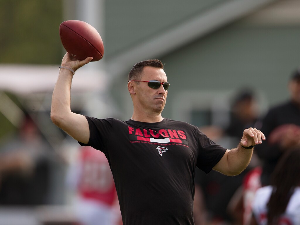 (AP Photo/John Bazemore. Former BYU quarterback Steve Sarkisian still has good passing form, but the Atlanta Falcons hired him to just call the plays, not execute them.