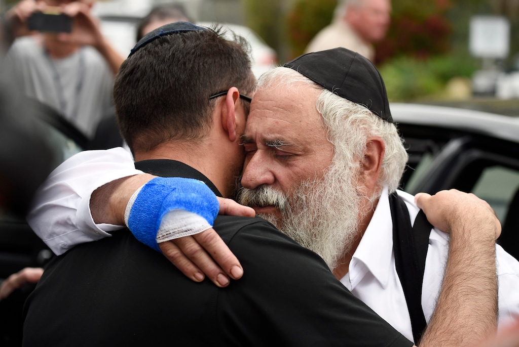 (Denis Poroy | AP file photo) Rabbi Yisroel Goldstein, right, is hugged as he leaves a news conference at the Chabad of Poway synagogue in Poway, Calif., on April 28, 2019, after a man opened fire inside the synagogue near San Diego as worshippers celebrated the last day of a major Jewish holiday.