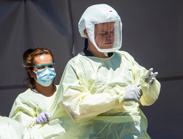 (Rick Egan  |  The Salt Lake Tribune)   Medical assists prepare for the next patient, at the Intermountain Healthcare Coronavirus Mobile Testing Unit at Utah Valley Hospital in Provo, Friday May 8, 2020.