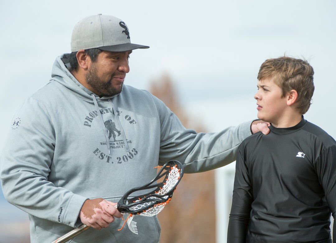 (Rick Egan | The Salt Lake Tribune) Box Elder lacrosse coach Juan Gaytan talks to player Quade Simpson after a tournament in Logan on Saturday, Nov. 3, 2018.