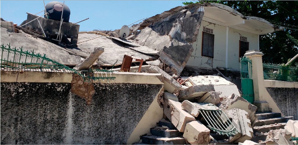 The residence of the Catholic bishop is damaged after an earthquake in Les Cayes, Haiti, Saturday, Aug. 14, 2021. (AP Photo/Delot Jean