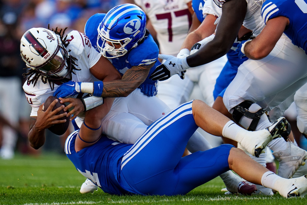 (Trent Nelson | The Salt Lake Tribune) Brigham Young Cougars defensive end Ephraim Asiata (44) sacks Southern Illinois Salukis quarterback DJ Williams (2) as BYU hosts Southern Illinois, NCAA football in Provo on Saturday, Aug. 31, 2024.