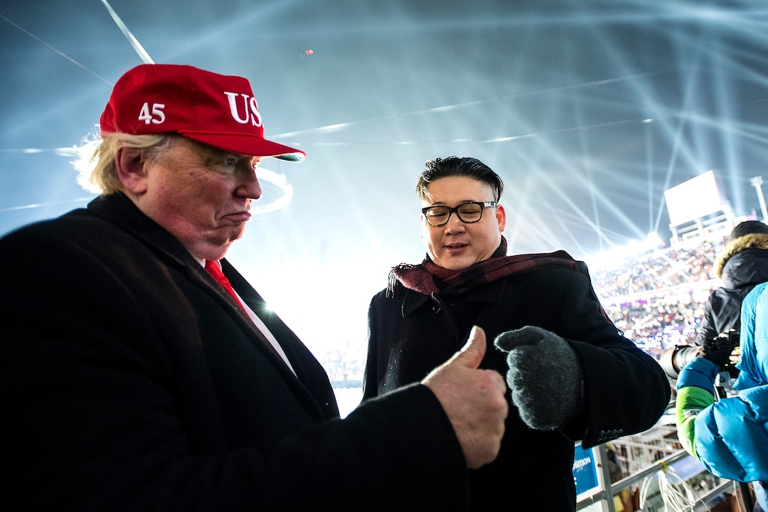 (Chris Detrick  |  The Salt Lake Tribune)  Men dressed up as U.S. President Donald Trump and Supreme Leader of North Korea Kim Jong Un fist bump during the Pyeongchang 2018 Winter Olympics opening ceremony at Olympic Stadium Friday, February 9, 2018.  