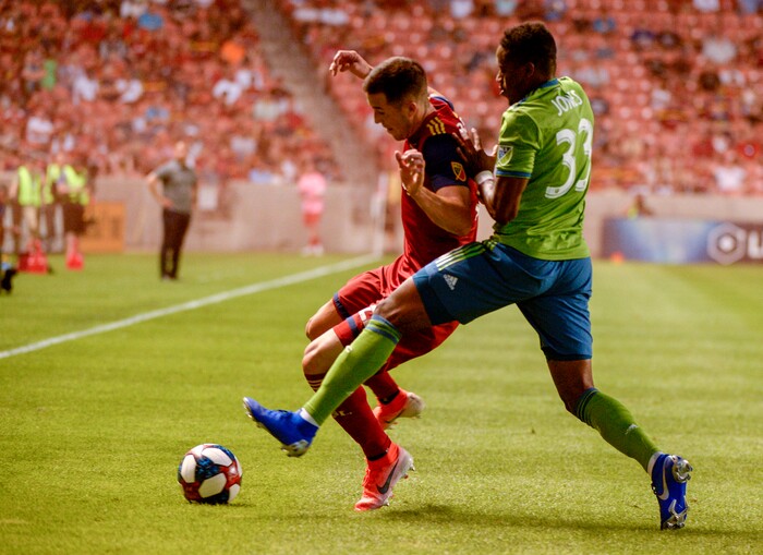 (Leah Hogsten  |  The Salt Lake Tribune) Real Salt Lake defender Aaron Herrera (22) battles Seattle Sounders defender Joevin Jones (33) as Real Salt Lake hosts the Seattle Sounders, Aug. 14, 2019, at Rio Tinto Stadium in Sandy.
