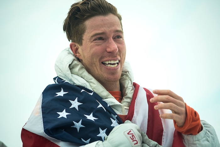 (Chris Detrick  |  The Salt Lake Tribune)  Shaun White reacts to seeing his friends and family after winning gold after his run during the men's halfpipe finals at Phoenix Snow Park during the Pyeongchang 2018 Winter Olympics Wednesday, Feb. 14, 2018.  White won the event with a 97.75, his third Olympic gold medal in the halfpipe (2006, 2010, 2018).