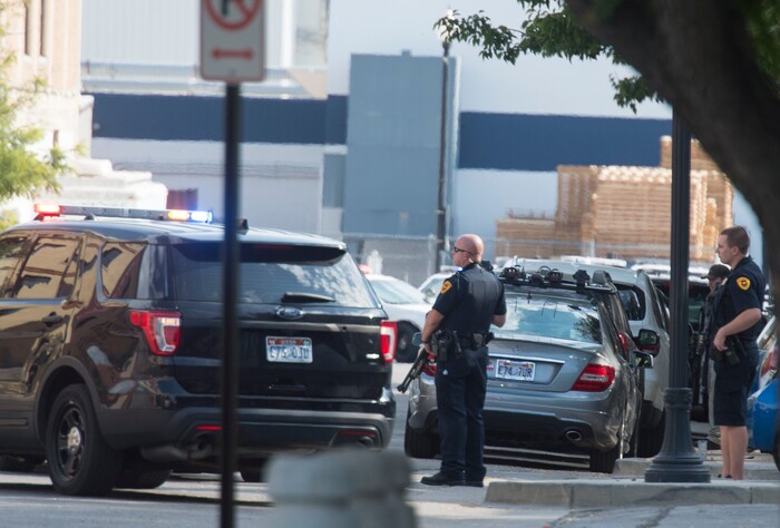(Rick Egan  |  The Salt Lake Tribune)   Police stand by as swat teams search buildings on Rio Grande Street for a suspect that fired shots at a police officer,  Wednesday, Sept. 5, 2018.


