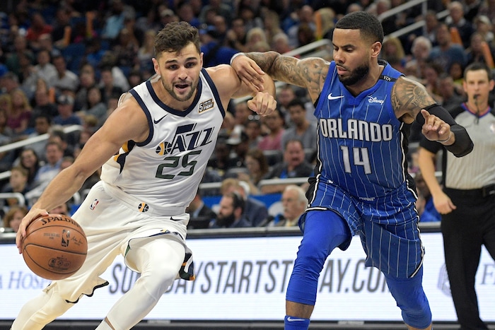 Utah Jazz guard Raul Neto (25) drives to the basket in front of Orlando Magic guard D.J. Augustin (14) during the first half of an NBA basketball game Saturday, Nov. 18, 2017, in Orlando, Fla. (AP Photo/Phelan M. Ebenhack)