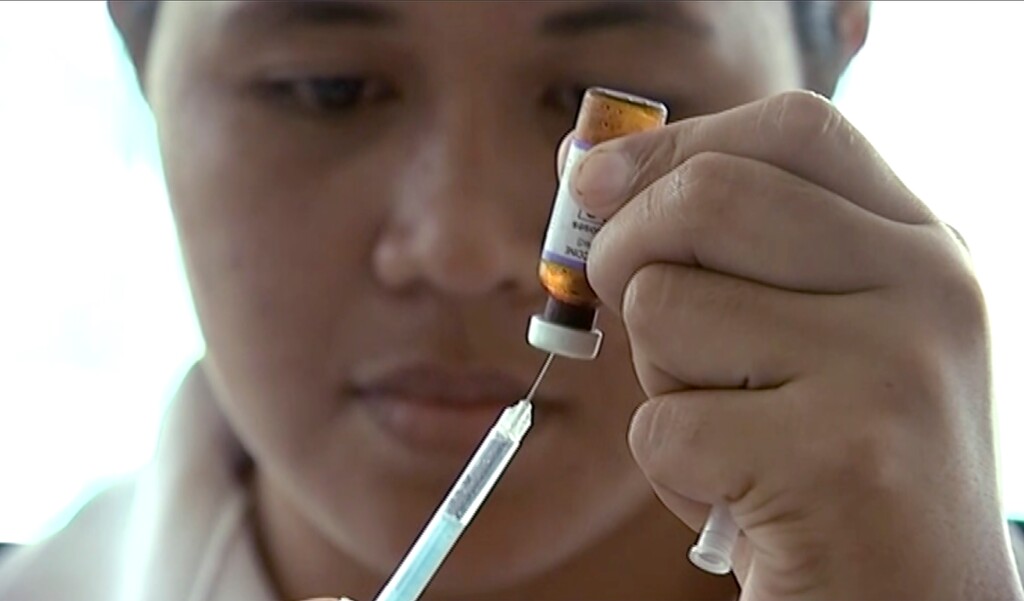 FILE - In this file image made from Nov. 25, 2019, file video, a New Zealand health official prepares a measles vaccination at a clinic in Apia, Samoa, during a measles outbreak. (Newshub via AP, File)
