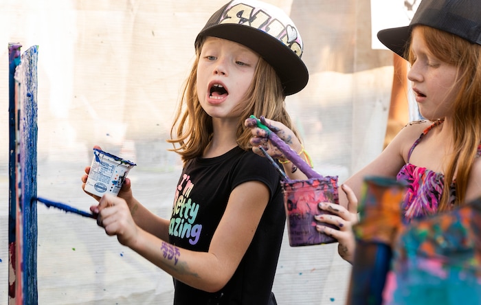 (Rick Egan | The Salt Lake Tribune)  Eloise Hall and Olivia Aledlde have fun painting at the creative corner at the Salt Lake Arts Festival, on Saturday, Aug. 28, 2021.