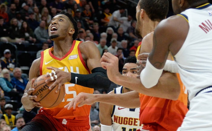 (Francisco Kjolseth  |  The Salt Lake Tribune)  Utah Jazz guard Donovan Mitchell (45) looks for an opening as the Utah Jazz host the Denver Nuggets in their NBA game at Vivint Smart Home Arena Tuesday, April 9, 2019, in Salt Lake City.