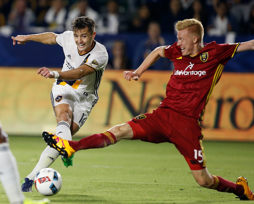 (Associated Press File Photo) Real Salt Lake defender Justen Glad, right, stops a shot by Los Angeles Galaxy forward Robbie Rogers, left, during an MLS playoff soccer match in Carson, Calif., Oct. 26, 2016. Galaxy won 3-1.
