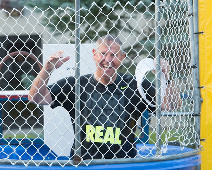 (Rick Egan  |  The Salt Lake Tribune)  Danny Ainge reacts after being dunked in a dunking booth, at a fundraiser in Provo for his son Tanner Ainge, who is running for congress, in Utah’s third district. Monday, August 7, 2017.