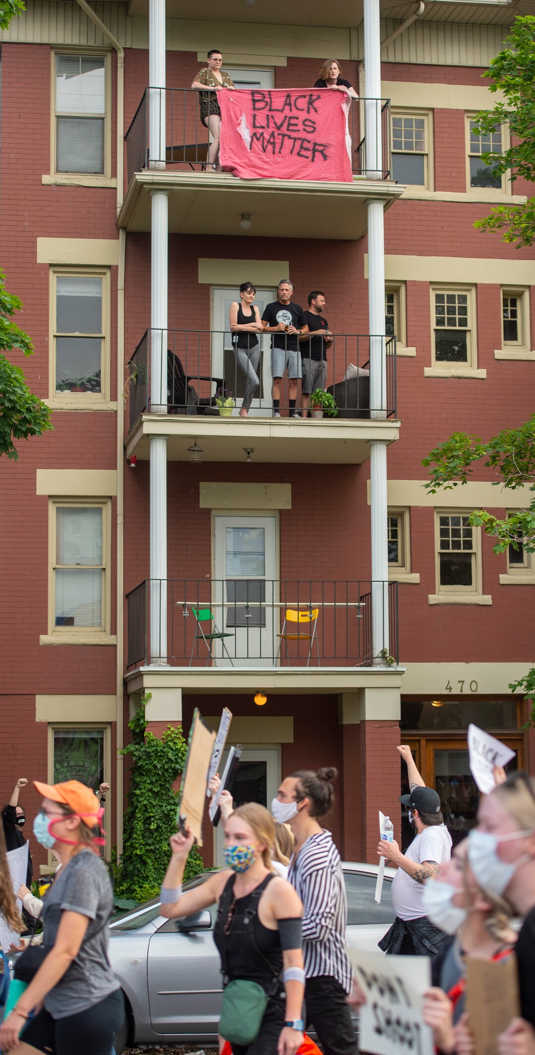 (Rick Egan  |  The Salt Lake Tribune) Local residents cheer on protesters as the March up 300 South in Salt Lake City on Wednesday, June 3, 2020.