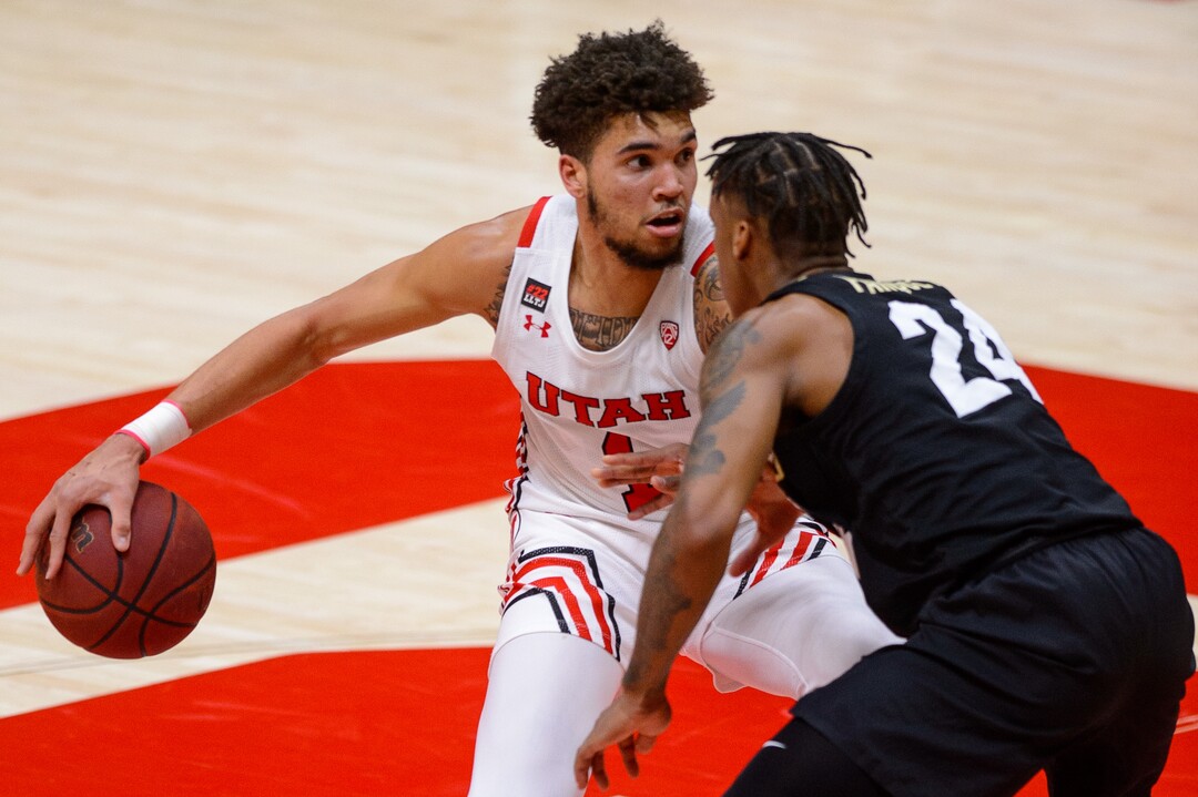 (Trent Nelson  |  The Salt Lake Tribune) Utah Utes forward Timmy Allen (1) defended by Colorado Buffaloes guard Eli Parquet (24) as Utah hosts Colorado, NCAA basketball in Salt Lake City on Monday, Jan. 11, 2021.