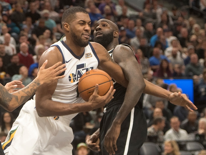 (Rick Egan  |  The Salt Lake Tribune)Utah Jazz forward Derrick Favors (15) gets tangled up with Brooklyn Nets forward Quincy Acy (13),  in NBA action, Utah Jazz vs. Brooklyn Nets, in Salt Lake City, Saturday, November 11, 2017.


