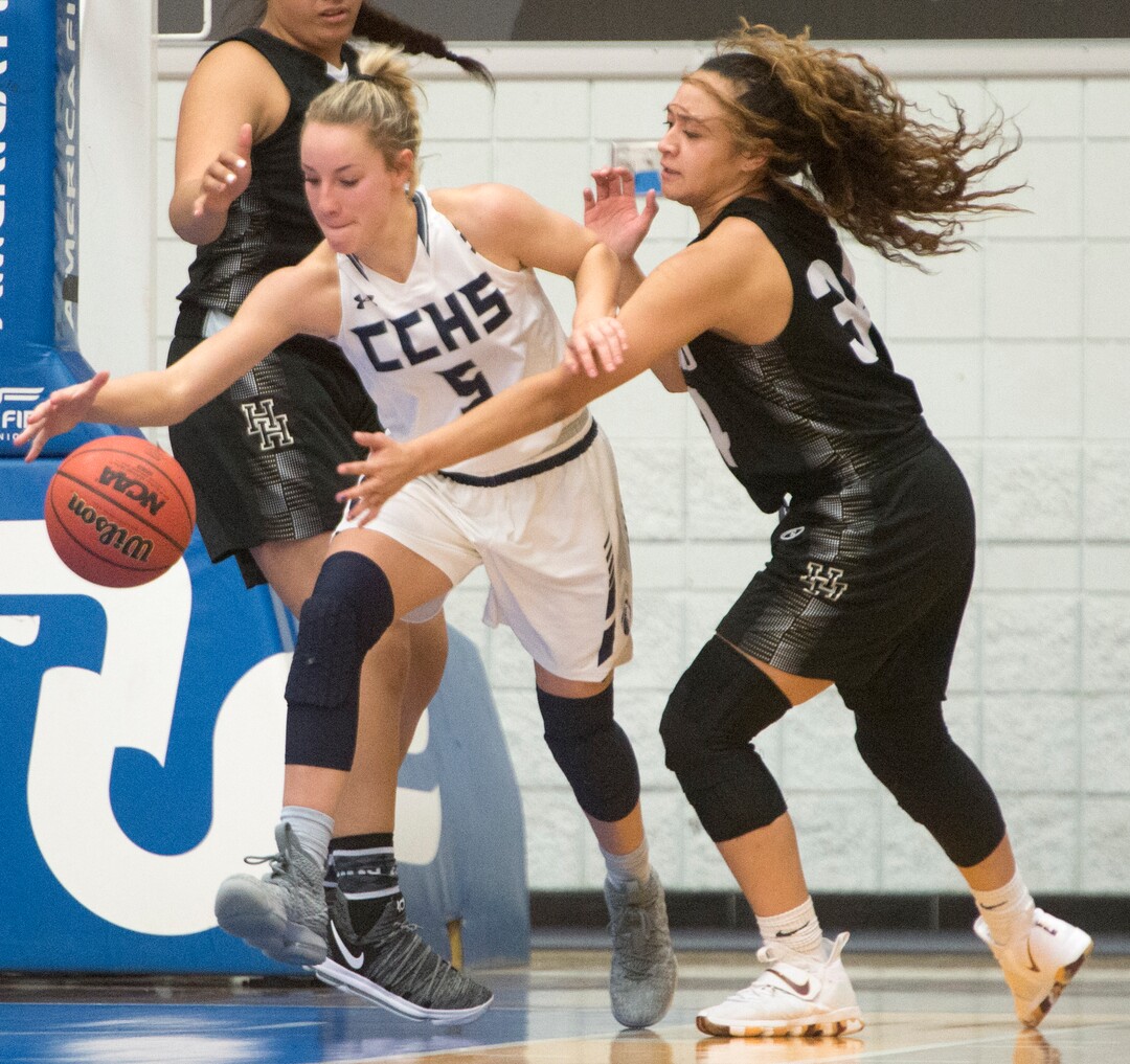 (Rick Egan  |  The Salt Lake Tribune)  Corner Canyon Chargers Nicole Critchfield (5) steals the ball from Highand High Rams Lana Olevao (33), in Class 5A women's basketball playoff game between Corner Canyon and Highland, Monday, Feb. 19, 2018.