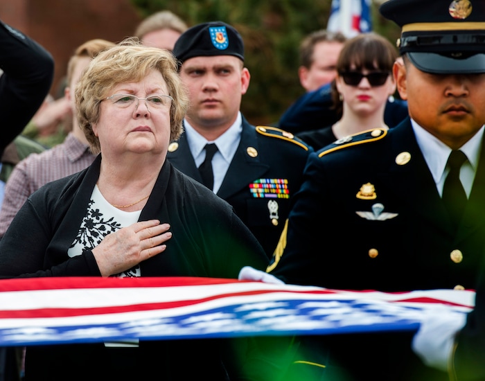 (Rick Egan  |  The Salt Lake Tribune)     Mary Ann Turner, the daughter of 2nd Lt. Lynn W. Hadfield, watches the Honor Guard fold up the American flag during the graveside service for her father, who was killed during the Second World War, at Veterans Memorial Park, in Bluffdale. Thursday, March 21, 2019.


