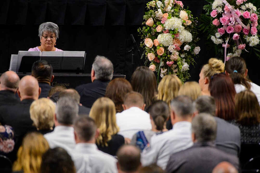 (Trent Nelson | The Salt Lake Tribune)  Celia Williams plays music at funeral services for Jill Robinson, a West Valley City code-enforcement officer killed on the job last week. The service took place at the Maverik Center in West Valley City on Friday Aug. 17, 2018.