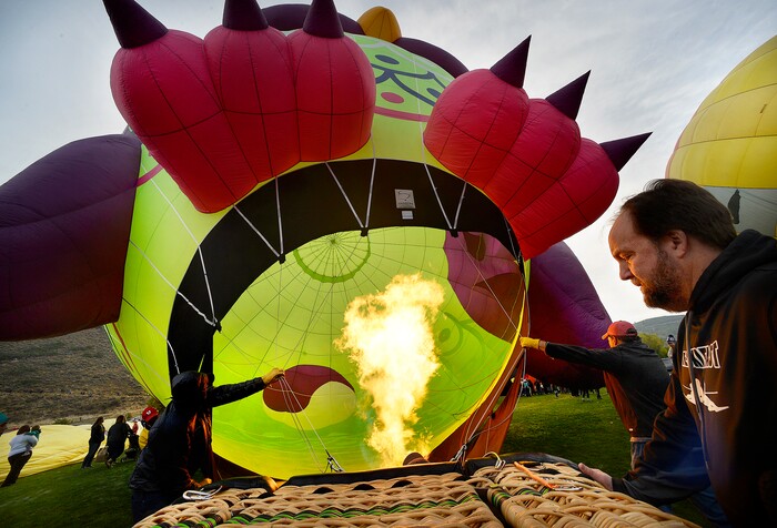 (Scott Sommerdorf | The Salt Lake Tribune)
The crew of the "Whoo'z Up" Owl balloon begins the "hot inflation" step to get the owl on its feet at the 4th annual Autumn Aloft Hot Air Balloon Festival in Park City, Sunday, September 17, 2017.