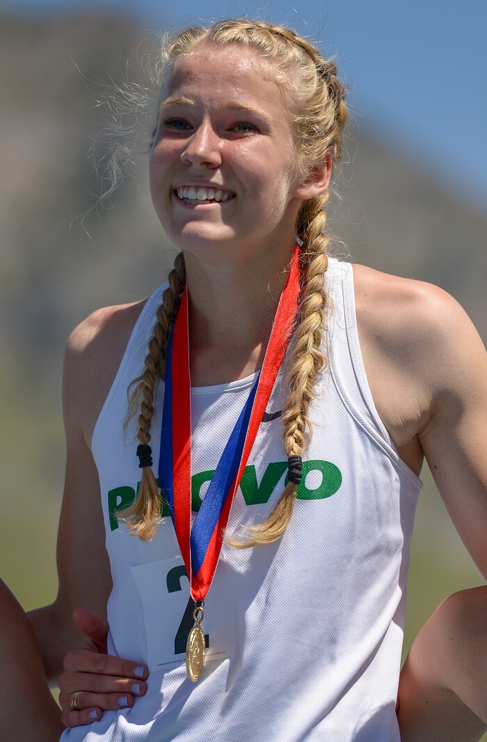 (Leah Hogsten | The Salt Lake Tribune) Provo's Meghan Hunter smiles on the podium after taking 1st in the 5A Girls' 800 Meter at the 2018 Utah UHSAA State Track and Field Championships at Clarence Robison Track on the campus of Brigham Young University in Provo, Thursday, May 17, 2018.