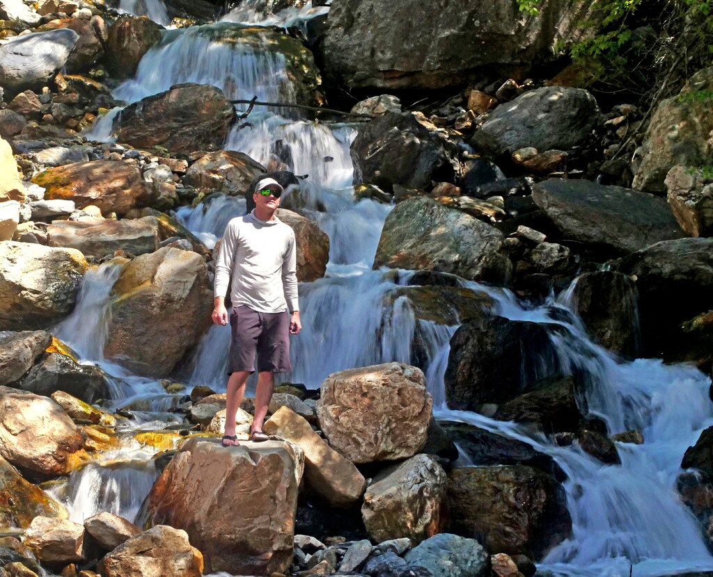 (AP Photo/Rick Bowmer)

This June 10, 2019, photo shows hiker Tony Larsen posing for a photograph at a waterfalls, in the Big Cottonwood canyon, near Salt Lake City.