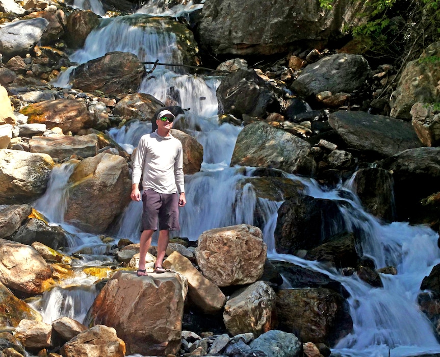 (AP Photo/Rick Bowmer)
This June 10, 2019, photo shows hiker Tony Larsen posing for a photograph at a waterfalls, in the Big Cottonwood canyon, near Salt Lake City.