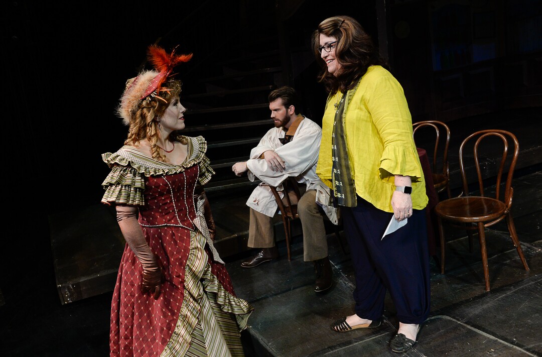 (Francisco Kjolseth  |  The Salt Lake Tribune)  Director Kathleen Clawson, right, sets up scenes for set photos as Utah Opera's season opener, "La bohème," Puccini's popular tearjerker about starving artists in turn-of-the-century Paris, opens for five shows on Oct. 7, 2017. On set were: Celena Shafer (Musetta), Michael Adams (Marcello).