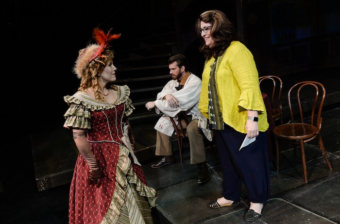 (Francisco Kjolseth  |  The Salt Lake Tribune)  Director Kathleen Clawson, right, sets up scenes for set photos as Utah Opera's season opener, "La bohème," Puccini's popular tearjerker about starving artists in turn-of-the-century Paris, opens for five shows on Oct. 7, 2017. On set were: Celena Shafer (Musetta), Michael Adams (Marcello).
