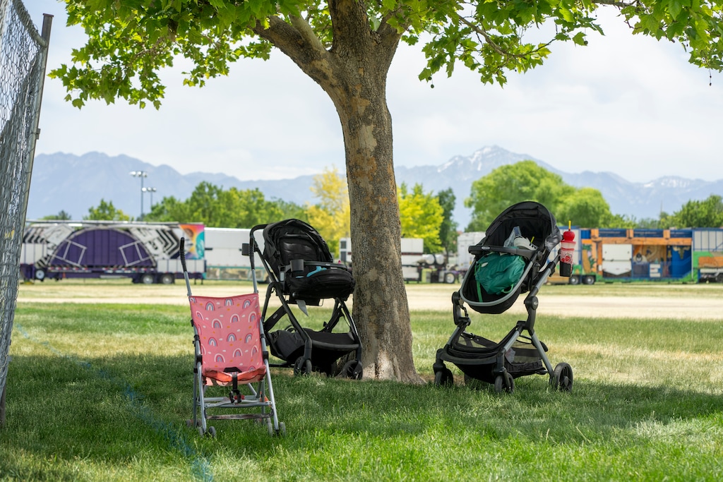 (Rick Egan | The Salt Lake Tribune) Abandoned strollers with backpacks and clothing remain at Centennial Park on Monday, June 16, 2025, after a shooting that happened Sunday at WestFest in West Valley City.