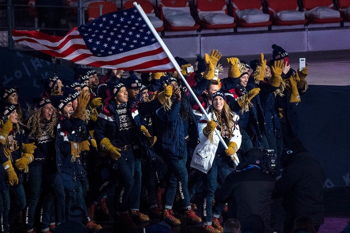 (Chris Detrick  |  The Salt Lake Tribune)  U.S. luger Erin Hamlin carries the American flag during the Pyeongchang 2018 Winter Olympics opening ceremony at Olympic Stadium Friday, February 9, 2018.  