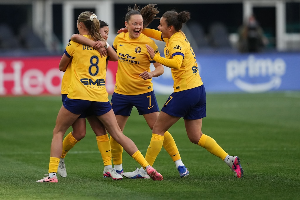 Utah Royals midfielder Narumi, left facing, celebrates her goal against the Seattle Reign FC with defender Kate Del Fava (8), midfielder Janni Thomsen (7) and defender Ana Tejada (17) during the first half of an NWSL soccer match, Sunday, April 26, 2026, in Seattle. The Royals and Reign battled to a 0-0 draw on Friday night in Sandy, Utah.(AP Photo/Lindsey Wasson)