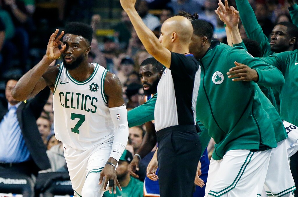 Boston Celtics' Jaylen Brown (7) celebrates his three-pointer during the first quarter of an NBA basketball game against the New York Knicks in Boston, Tuesday, Oct. 24, 2017. (AP Photo/Michael Dwyer)