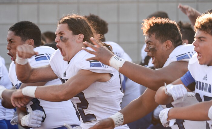 (Francisco Kjolseth  |  The Salt Lake Tribune)  The Bingham football team gets themselves pumped up before the start of their game against East High at East on Friday, Aug. 24, 2018.