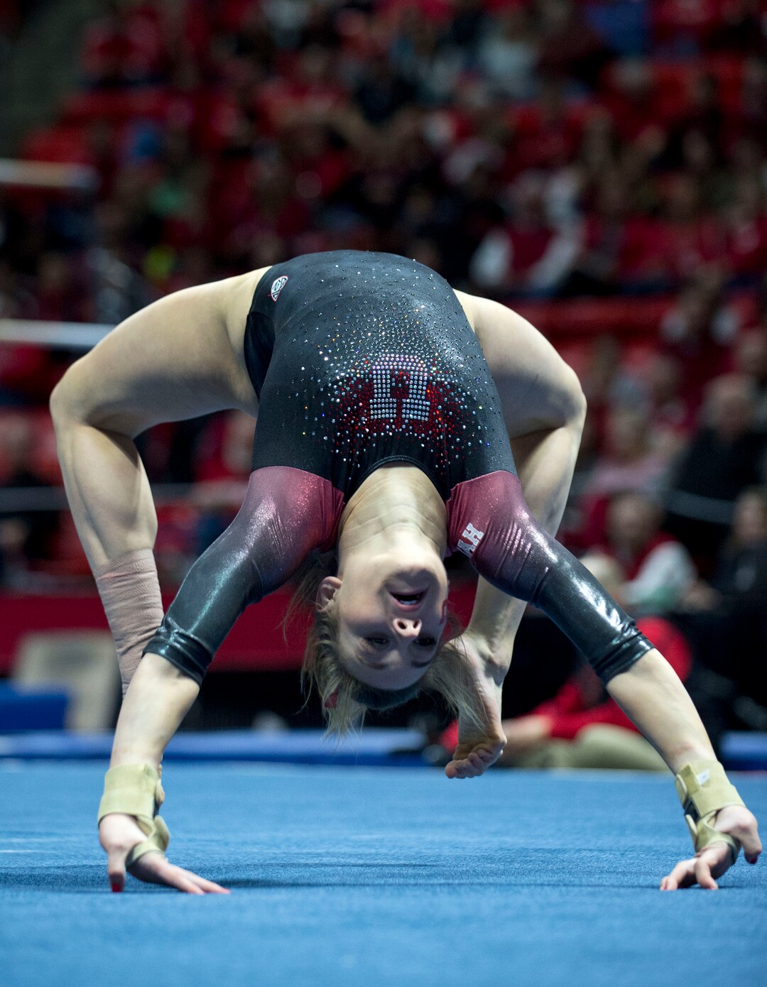 Lennie Mahler  |  The Salt Lake TribuneTiffani Lewis kips up in an exhibition routine on the floor during a super meet at the Huntsman Center on Friday, Jan. 16, 2015.