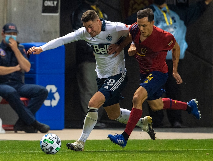 (Rick Egan  |  The Salt Lake Tribune)   Real Salt Lake defender Donny Toia (4) brings the ball down field as Vancouver Whitecaps defender Jake Nerwinski (28) defends, in MLS soccer action between Real Salt Lake and the Vancouver Whitecaps at Rio Tinto Stadium on Saturday, Sept. 19, 2020.

 