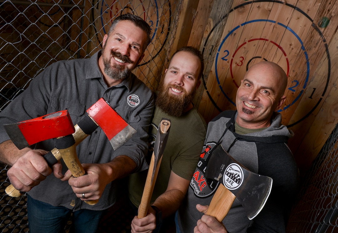 (Leah Hogsten  |  The Salt Lake Tribune)  Social Axe Throwing owners and partners Mark Floyd, left, Brayden Floyd and Steve Lister.