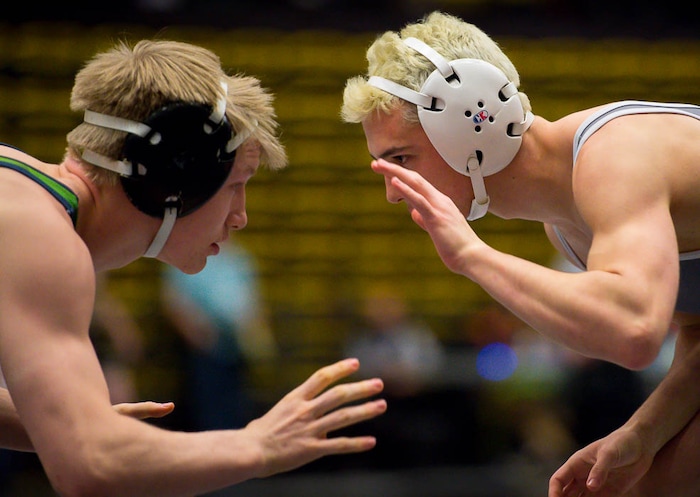 (Trent Nelson | The Salt Lake Tribune)  Syracuse's Bridger Ostler (left) and Hunter's Andrew Easdale, 6A State Championships, high school wrestling quarterfinals in Orem, Wednesday February 7, 2018.
