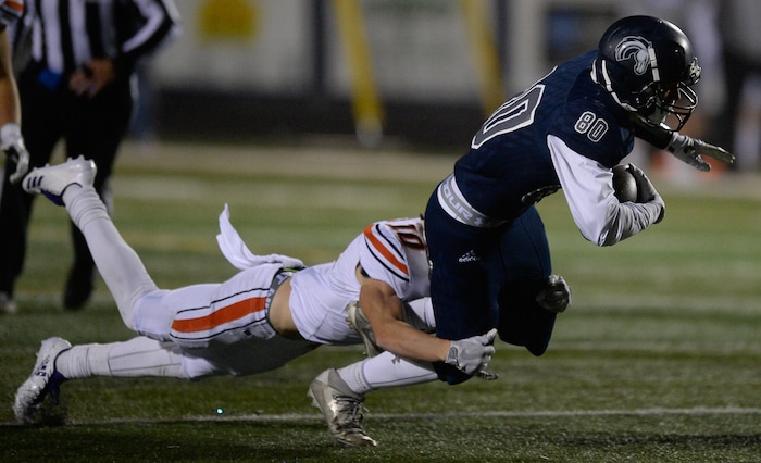 (Francisco Kjolseth  |  The Salt Lake Tribune)  Payton Madsen of Timpview tackles Noah Kjar of Corner Canyon in game action between Timpview at Corner Canyon on Thursday, Sept. 21, 2017.