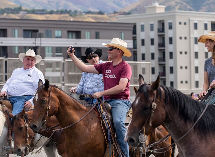 (Leah Hogsten | The Salt Lake Tribune) To kick off the start of Utah's Days of '47 rodeo week, Governor Spencer Cox, First Lady Abby Cox and working ranglers drove a herd of longhorn cattle from the heart of Salt Lake City to the  Utah Fair Park, Tuesday, July 19, 2022.