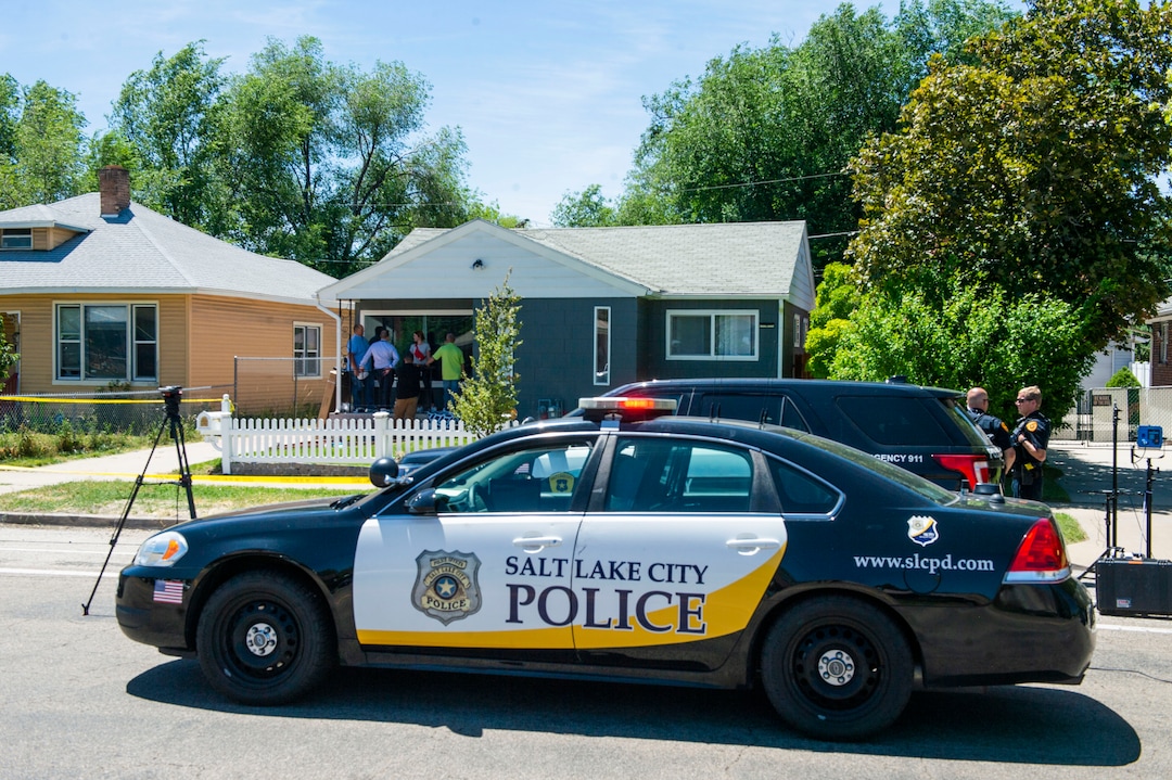 (Rick Egan  |  The Salt Lake Tribune)       Crime scene Investigators gather on the porch of at the Fairpark home on 547 North 1000 West, Friday, June 28, 2019.